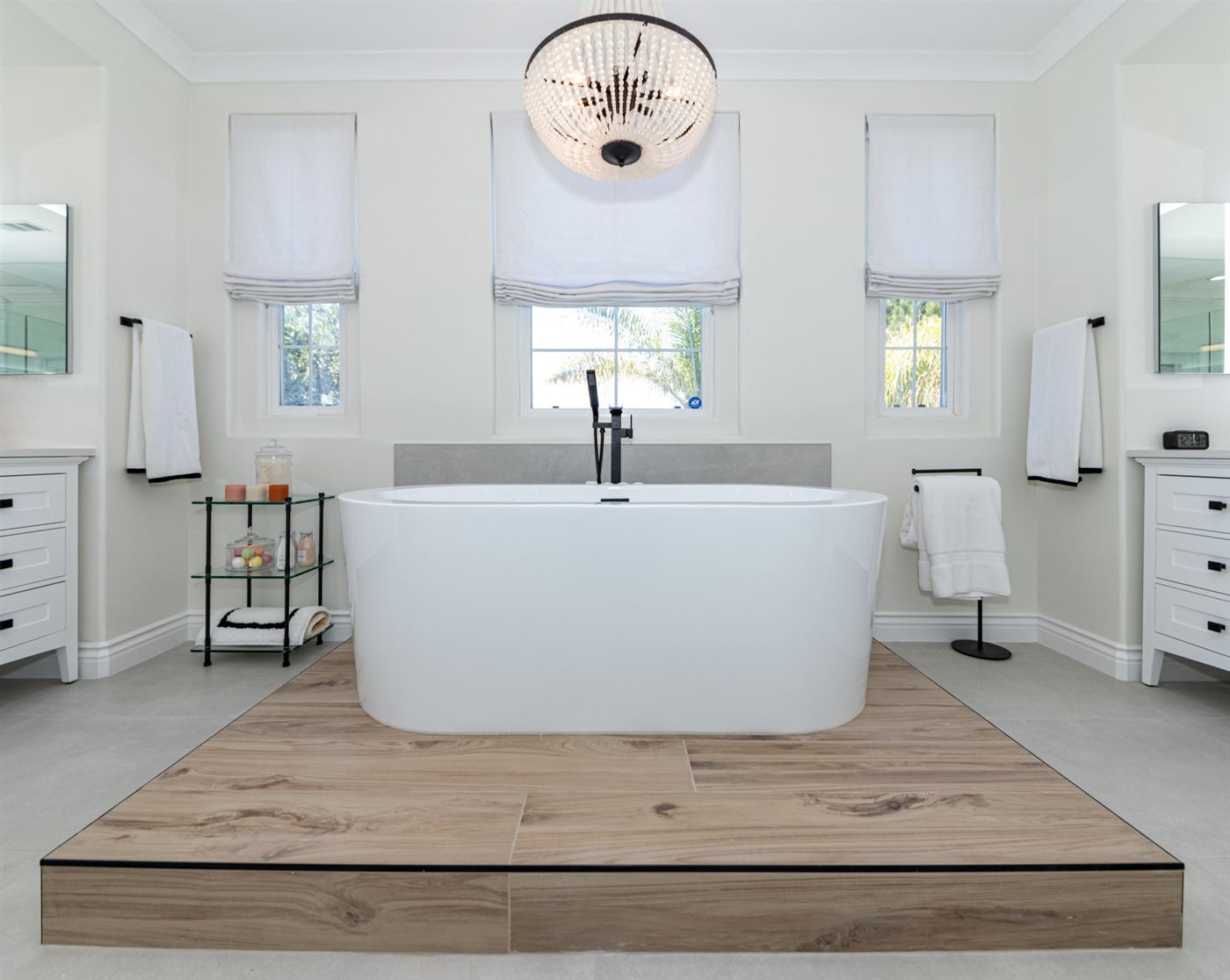 Westlake Village bathroom remodel — freestanding tub on wood platform with matte black fixtures