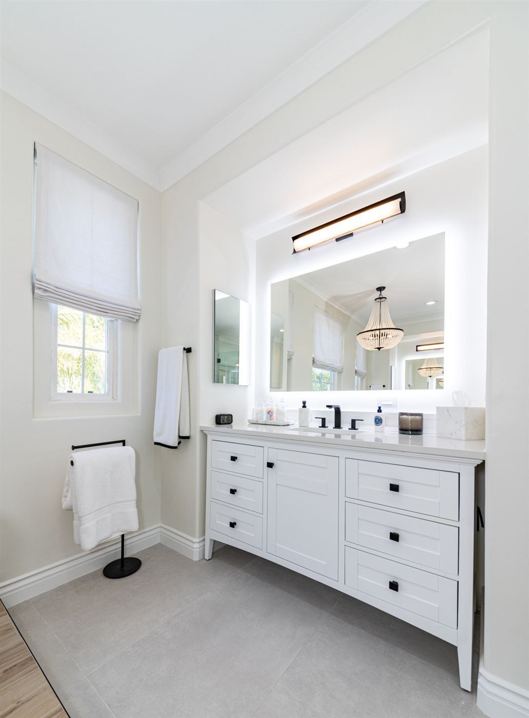 Westlake Village bathroom remodel — freestanding tub on wood platform with matte black fixtures
