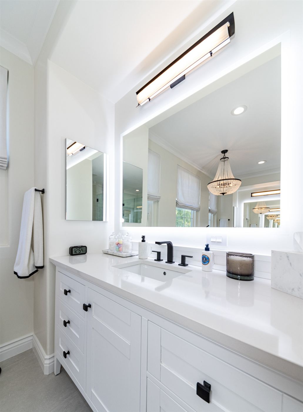 Westlake Village bathroom remodel — freestanding tub on wood platform with matte black fixtures